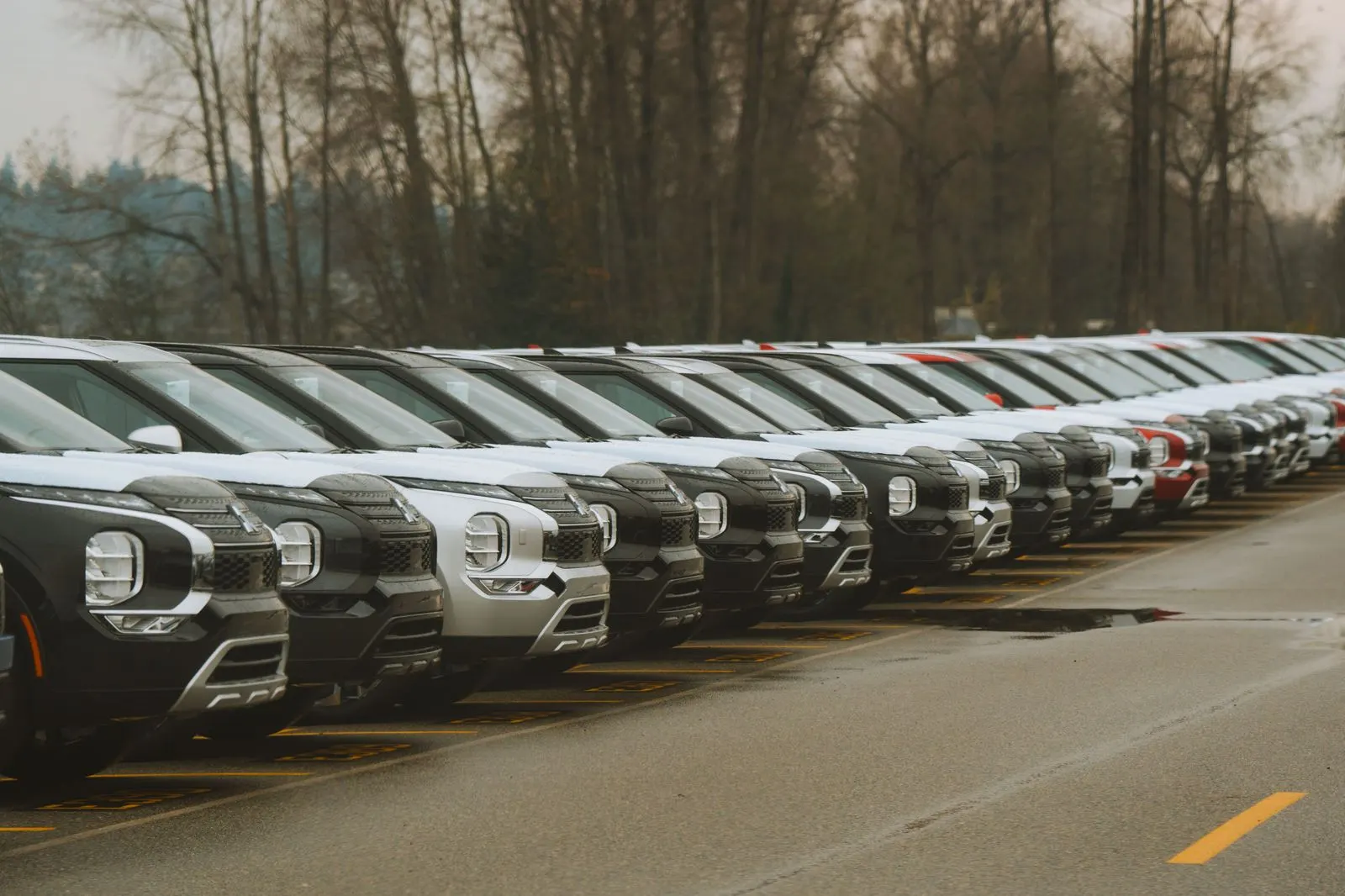 Line-up of an executive sedan, an SUV, a Sprinter and a coach outside an airport terminal