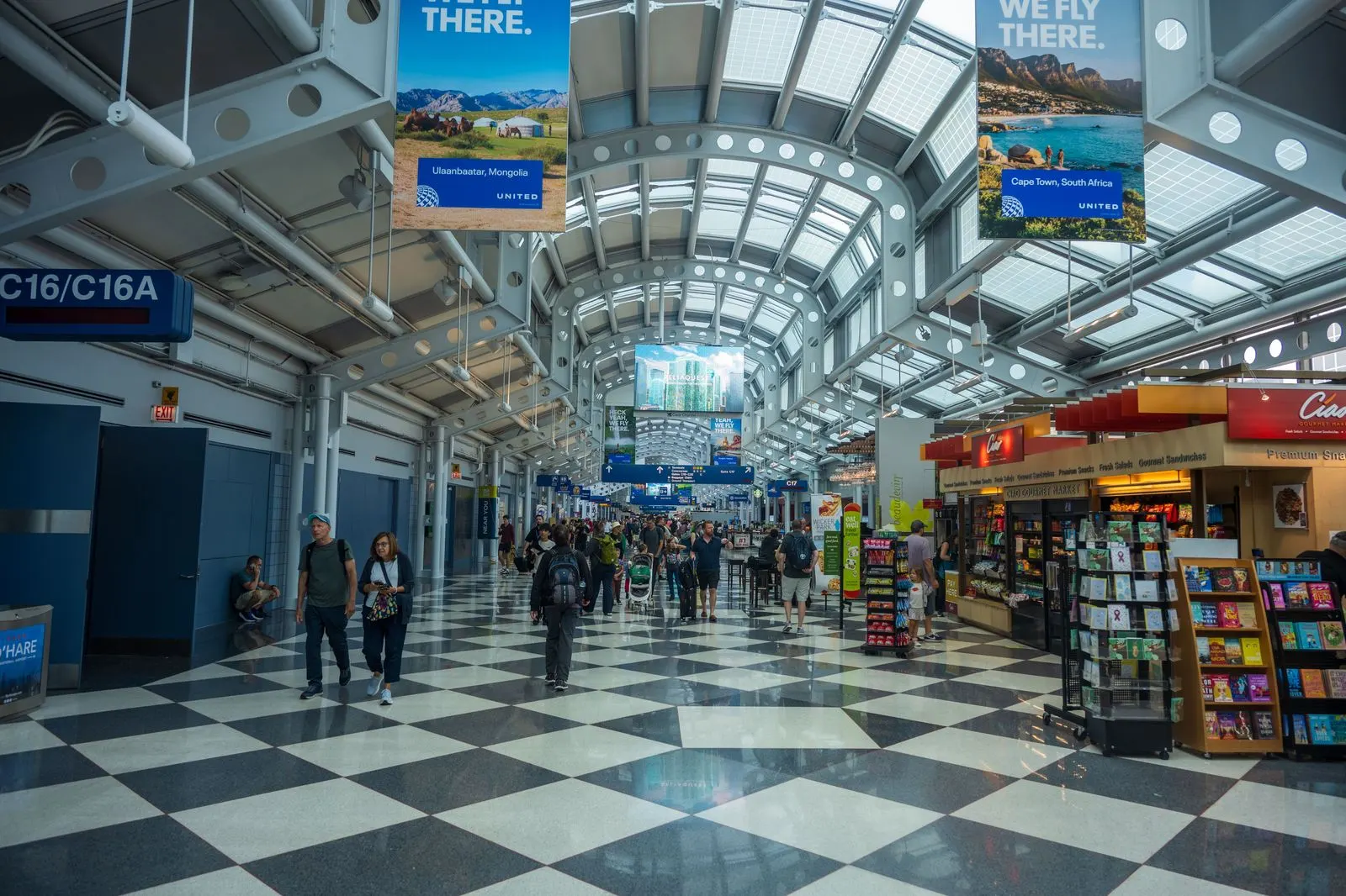 A world map of gateway cities with chauffeured vehicles waiting at an international arrivals terminal